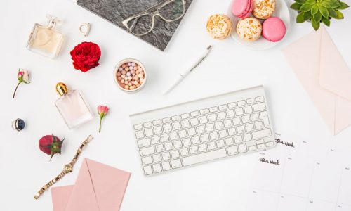 top-view-of-white-office-female-workspace-with-pc-PCJVTC5.jpg